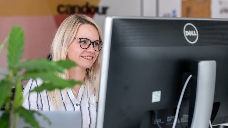 Kristiana working at her computer at Candour